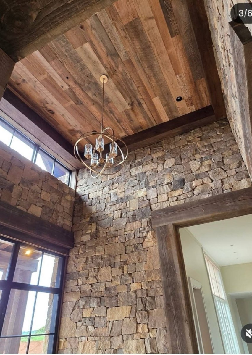 Stone fireplace surround with custom ceiling trim work